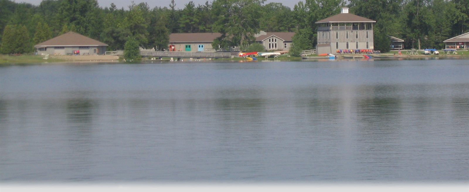 The lake and cabins at Camp Trillium Rainbow Lake.